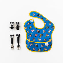 Load image into Gallery viewer, Mickey &amp; Friends SuperBib 3-pack shown flat on white beside matching Mickey spoon, fork, and Chewtensils.
