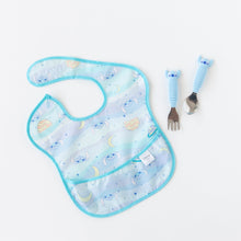 Load image into Gallery viewer, Bumkins Spoon + Fork: Stitch sits by a pastel blue Stitch-themed bib on a white background.
