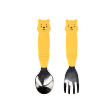 Load image into Gallery viewer, Bumkins Spoon + Fork: Winnie the Pooh includes two utensils with yellow bear-shaped silicone handles and stainless steel heads.
