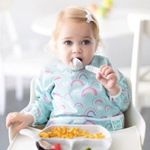 Load image into Gallery viewer, A toddler in a high chair eats pasta with Bumkins Spoon + Fork: Marble from a matching plate, wearing a bib featuring rainbow patterns.
