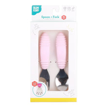 Load image into Gallery viewer, Bumkins Spoon + Fork: Pink is shown in a white packaging box with a clear front window displaying the set of utensils.
