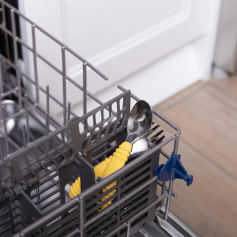 Bumkins Spoon + Fork: Pineapple sits in the utensil compartment of an open dishwasher.