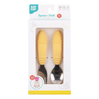 Bumkins Spoon + Fork: Pineapple is shown in a white packaging box with a clear front window displaying the set of utensils.