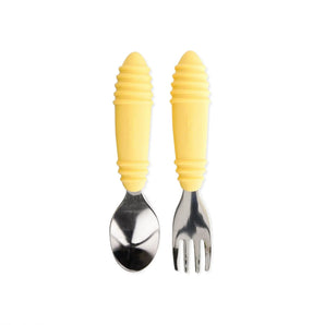 Bumkins Spoon + Fork: Pineapple includes two utensils with yellow ribbed silicone handles and stainless steel heads.