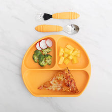 Load image into Gallery viewer, Bumkins Spoon + Fork: Tangerine sits above an orange divided plate with pizza, broccoli, radish, and pineapple on a marble background.
