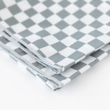 A folded Bumkins Splat Mat: Charcoal Check on a white background, showcasing an easy-clean design.