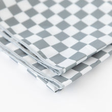 Load image into Gallery viewer, A folded Bumkins Splat Mat: Charcoal Check on a white background, showcasing an easy-clean design.
