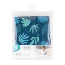 Load image into Gallery viewer, Bumkins Splat Mat: Blue Tropic is shown folded in a plastic packaging bag with a hanger and cardboard insert.
