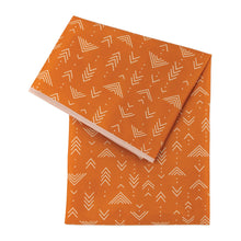Load image into Gallery viewer, Bumkins Splat Mat: Grounded features easy-wipe orange waterproof fabric with white geometric arrow patterns.
