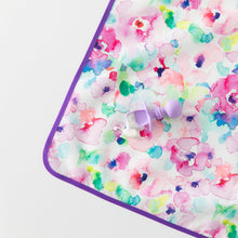 Load image into Gallery viewer, A Bumkins Silicone Chewtensils®: Lavender lays on top of a floral mat with yogurt splatter on a white background.
