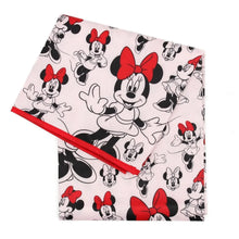 Load image into Gallery viewer, Bumkins Splat Mat: Minnie Mouse is made of pink waterproof fabric with a Minnie Mouse design and red trim.
