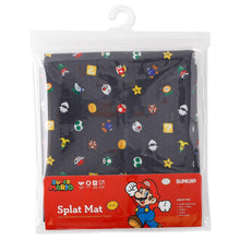 Load image into Gallery viewer, Bumkins Splat Mat: Super Mario™ Lineup is shown folded in plastic packaging bag with a hanger and cardboard insert.

