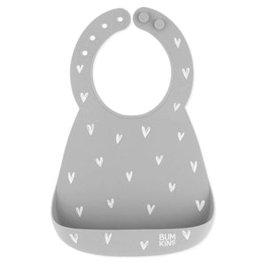 Bumkins Silicone Bib: Hearts features gray silicone with a white heart design, an adjustable neck strap, and a handy catch-all pocket.