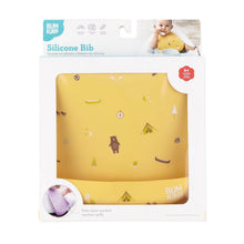 Load image into Gallery viewer, Bumkins Silicone Bib: Camp Gear is shown in a white packaging box with a clear front window displaying the bib.
