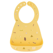 Load image into Gallery viewer, Bumkins Silicone Bib: Camp Gear features a camping design with tents, trees, and bears on yellow silicone, with a front pocket.
