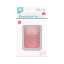 Load image into Gallery viewer, Bumkins Silicone Starter Cup: Pink is shown in a white packaging box, with a front window displaying the cup.
