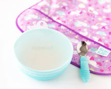 Load image into Gallery viewer, Bumkins Silicone Stretch Lid for Grip Bowl covers a blue bowl next to a blue spoon and purple bib on a white background.
