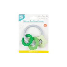 Load image into Gallery viewer, Bumkins Silicone Teething Charms: Green is shown affixed to a white cardboard packaging card.
