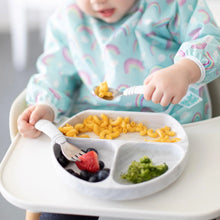 Load image into Gallery viewer, Close-up of a toddler in a high chair using Bumkins Spoon + Fork: Marble to enjoy mac &amp; cheese, broccoli, and berries from a matching plate.
