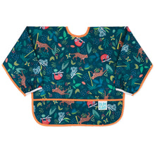 Load image into Gallery viewer, Bumkins Sleeved Bib: Jungle is made of dark teal waterproof fabric with animal illustrations, orange trim, and front pocket.
