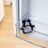 Bumkins Silicone Flat Teether: Mickey Mouse sits in the side compartment of an open refrigerator door.