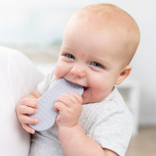 Load image into Gallery viewer, A smiling baby chews on a Bumkins Silicone Teether: Nintendo SNES™ Controller, enjoying soothing gum relief.
