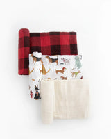 The Cotton Swaddle Set, Woof by Little Unicorn includes a breathable red checkered, dog prints, & solid cream muslin blankets on white.