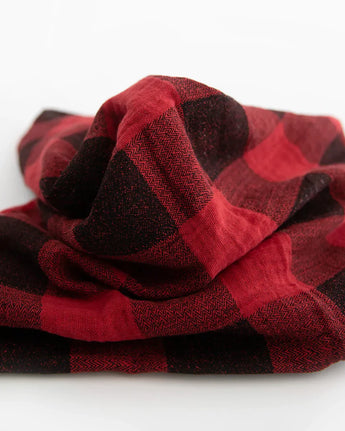 The Cotton Swaddle Set, Woof by Little Unicorn features a breathable red and black checkered fabric against a white backdrop.