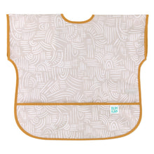 Load image into Gallery viewer, Bumkins Junior: Bib Wander features beige waterproof fabric with abstract white patterns, orange trim, and a catch-all pocket.
