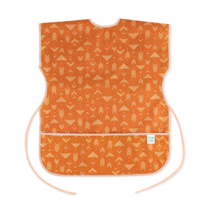 Bumkins Short-Sleeved Smock: Grounded features a white geometric pattern on orange waterproof fabric with an adjustable tie waist.
