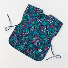 Load image into Gallery viewer, Bumkins Short-Sleeved Smock: Animal Prints lays flat on a white background.
