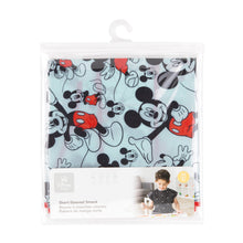 Load image into Gallery viewer, Bumkins Short-Sleeved Smock: Mickey Mouse Classic is shown folded in a plastic packaging bag with a hanger and cardboard insert.
