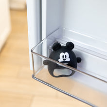 Load image into Gallery viewer, Bumkins Silicone Un-Droppable Mitt Teether: Mickey Mouse sits in a clear fridge door compartment.
