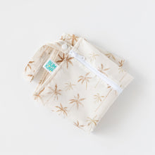 Load image into Gallery viewer, Bumkins Wet Bag: Palm Daze lays folded on a white background.
