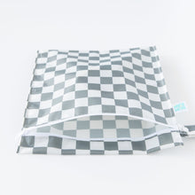 Load image into Gallery viewer, A partially open Bumkins Wet Bag: Charcoal Check lays on a white background.
