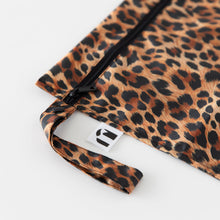Load image into Gallery viewer, Close-up of Roamio by Bumkins Wet Bag: Leopard on a white background, with focus on the zipper and side handle.
