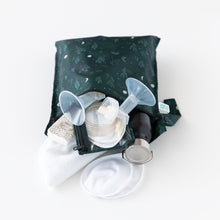 Load image into Gallery viewer, Bumkins Wet Bag: Starry Cactus holds a breast pump, tubes, pads, and a bottle on a white background.

