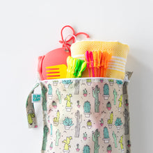 Load image into Gallery viewer, Bumkins Wet Bag: Cacti holds a towel, swimsuit, and colorful pool toys on a white background.
