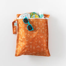Load image into Gallery viewer, Bumkins Wet Bag: Grounded holds sunglasses, sunscreen, and shoes on a white background.
