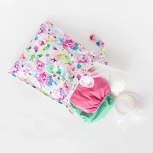 Load image into Gallery viewer, Bumkins Wet Bag: Watercolor holds cloth diapers and a breast pump on a white background.
