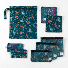 Load image into Gallery viewer, Bumkins Wet Bag: Jungle lays flat among other bags with similar prints on a white background.
