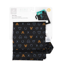 Load image into Gallery viewer, Bumkins Wet Bag: Minnie Mouse Icon Black + White is shown folded in its packaging.
