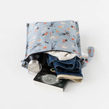 Bumkins Wet Bag: No Tricks, Just Treats showcases a bottle, clothes, and book against a crisp white backdrop.