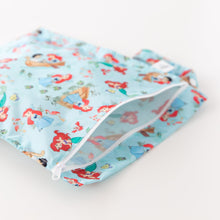 Load image into Gallery viewer, Close-up of Bumkins Wet Bag: Disney Princess Ariel partially open on a white background, showcasing the interior.
