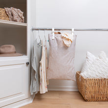 Load image into Gallery viewer, A closet with clothes, a basket of pillows, blankets on a shelf, and Bumkins Extra Large Wet Bag: Wander hanging next to clothes on a rack.
