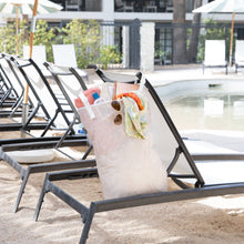 Load image into Gallery viewer, Bumkins Extra Large Wet Bag: Wander sits hangs from a poolside lounge chair, providing waterproof storage for swim essentials.
