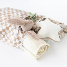 Load image into Gallery viewer, Bumkins Wet/Dry Bag: Sand Check with plush star, rabbit, pacifier, and blanket on a white background.
