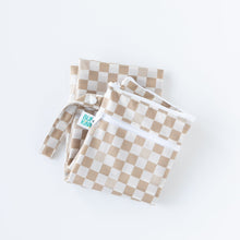 Load image into Gallery viewer, Bumkins Wet/Dry Bag: Sand Check is folded on a white background.
