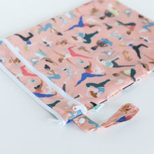 Load image into Gallery viewer, Bumkins Wet/Dry Bag: Yoga Pals rests on a white background with the loop handle angled toward the camera.
