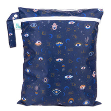 Load image into Gallery viewer, Bumkins Wet/Dry Bag: Evil Eye features celestial prints with eyes, stars, moons, and zodiac signs on dark blue waterproof fabric.
